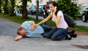 Woman with Man in Recovery Position epilepsy bracelets